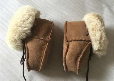 China Sapatas de bebê genuínas da pele de carneiro, botas do inverno para o infante/criança fornecedor